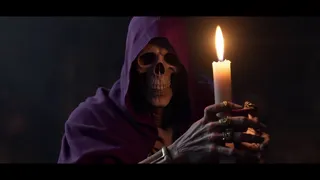 A skeletal figure shrouded in a deep purple hooded cloak holds a lit candle that softly illuminates its detailed, ring-adorned hands in a dark fantasy setting.