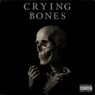 Album cover titled Crying Bones featuring a skeleton portrait with a single tear and a skeletal hand on a black background, including a parental advisory explicit content sticker.