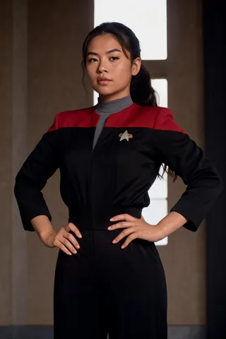 Upper body portrait of a confident half Latina half Asian female student wearing a red and black uniform with black sleeves and pants, standing with hands on hips in warm golden hour lighting, showcasing high detail and realism.