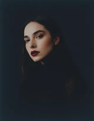 Close-up photography portrait of a young woman with dark red lips and dramatic lighting, showcasing incredible realism and intimate expression.
