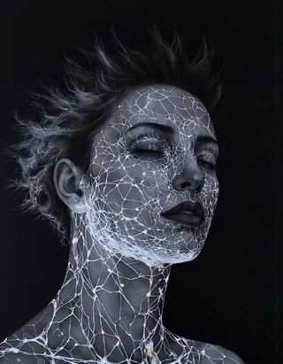 Digital illustration of a wire-frame portrait of a woman's face and neck with glowing white textured lines over dark background, serene expression with closed eyes, spiky hair, and dark lips.
