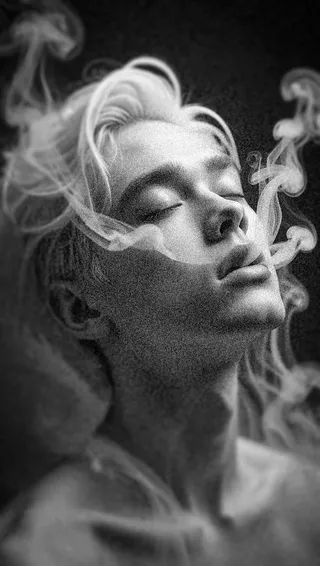 A monochrome close-up portrait of a young person with platinum blonde hair and closed eyes surrounded by white smoke curls, lit with dramatic side lighting and added noise.