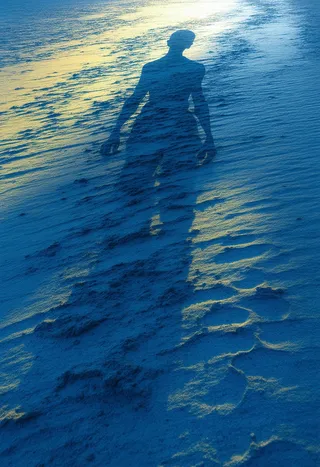 Shadow of a solitary human figure cast on a textured deep blue surface with hints of neon yellow light, evoking a dreamlike and ephemeral atmosphere.