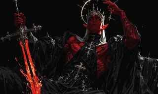 A muscular red-skinned man with pointed ears wearing a dark flowing robe adorned with crosses, holding a flaming sword upright. He wears a metallic crown with a glowing halo behind his head, set against a black background with dramatic lighting highlighting his detailed form.