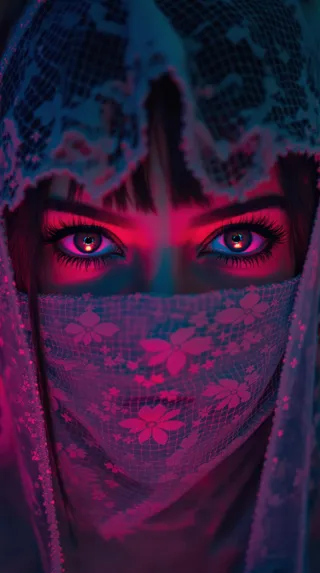 Close-up of intense eyes behind a floral lace veil illuminated by vibrant neon reflections in pink and blue tones.