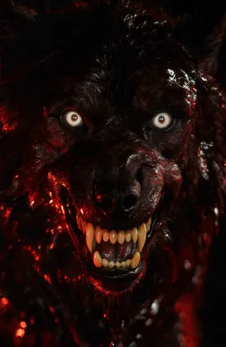 Close-up of a terrifying werewolf with glowing white eyes, sharp yellowed teeth, dark wet fur reflecting red light, and a menacing grin.