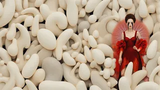 Elegant woman in a red dress with black tears, surrounded by many pale bulbous organic shapes.